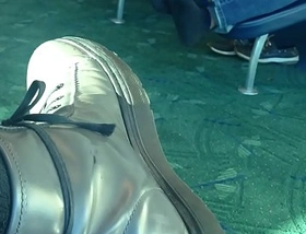 Mature man sockplay in airport terminal