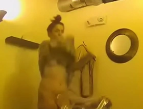 Athletic brunette gets naked on dressing room spy cam